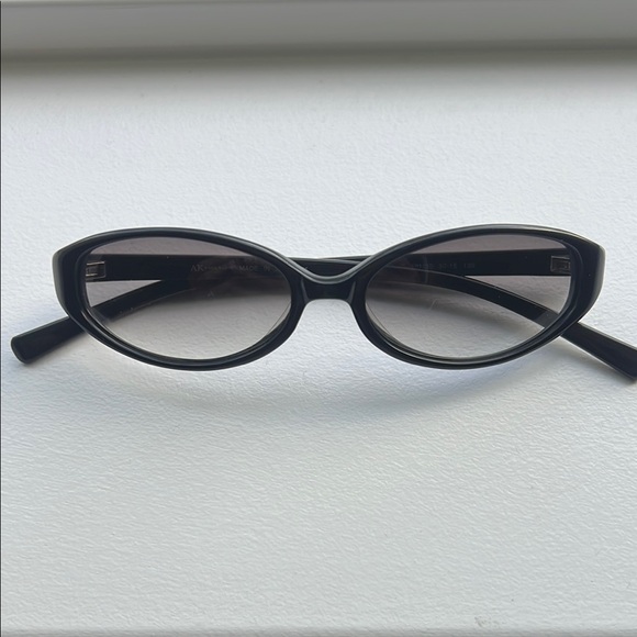 Anne Klein Black Cat-Eye Sunglasses with Vintage-Inspired Design - Picture 1 of 6